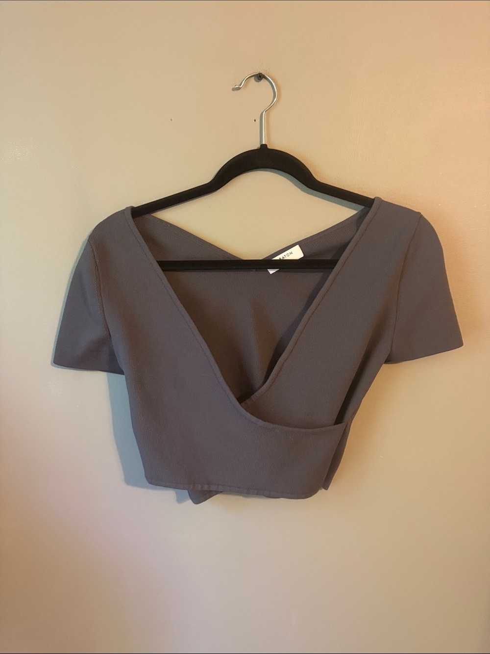Aritzia Babaton top features a plunging v-neckline and a wrap-style. Med